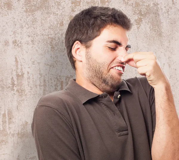 Young man smelling — Stock Photo, Image