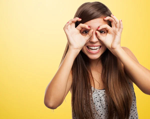 Woman doing glasses gesture — Stock Photo, Image