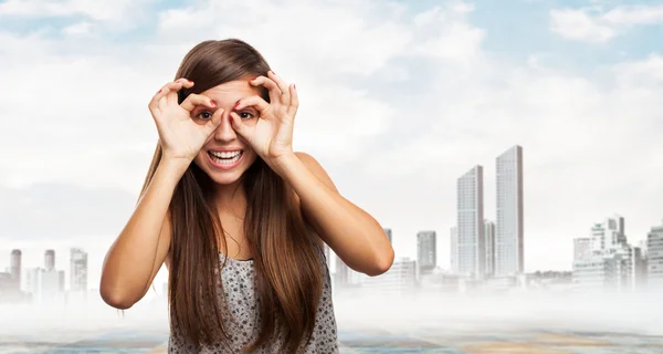 Woman doing glasses gesture — Stock Photo, Image