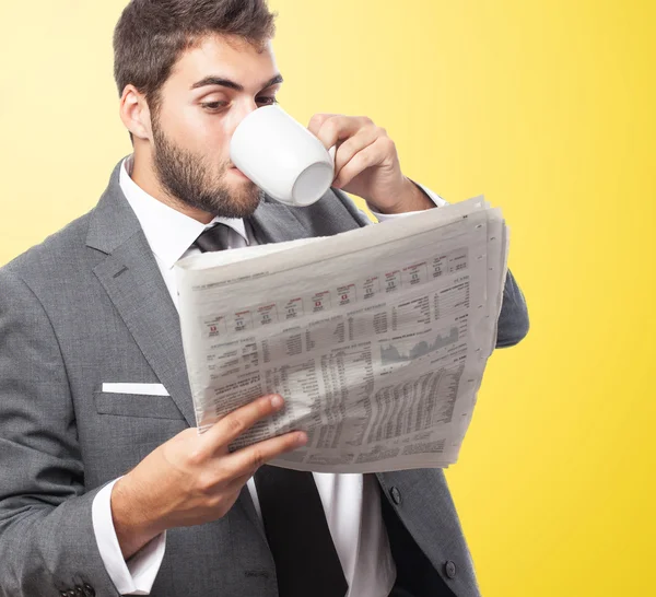 Business man drinking and reading — Stock Photo, Image