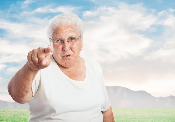 Elder woman pointing — Stock Photo, Image