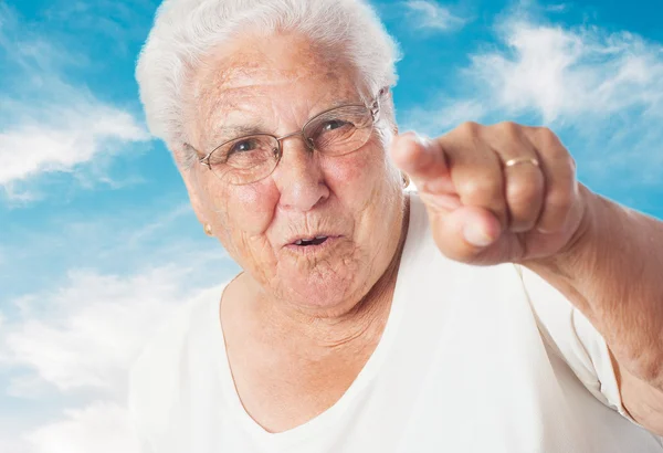 Elder woman pointing — Stock Photo, Image