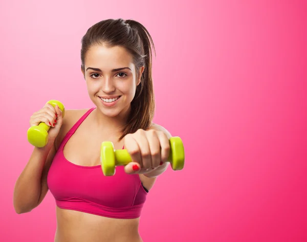 Girl exercising with weights — Stock Photo, Image