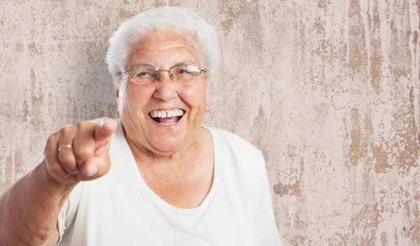Elder woman pointing with finger — Stock Photo, Image