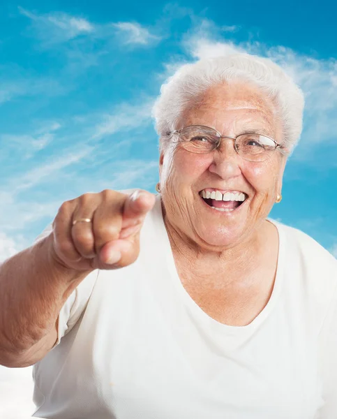 Elder woman pointing with finger — Stock Photo, Image