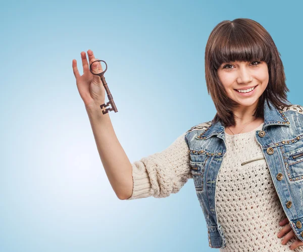 Woman holding key — Stock Photo, Image