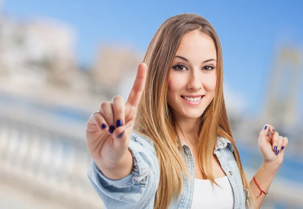 Mujer mostrando el signo número uno — Foto de Stock