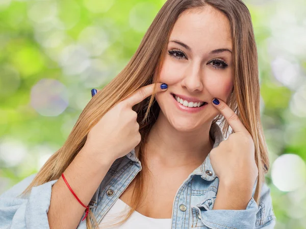 Girl making sign to smile — Stock Photo, Image