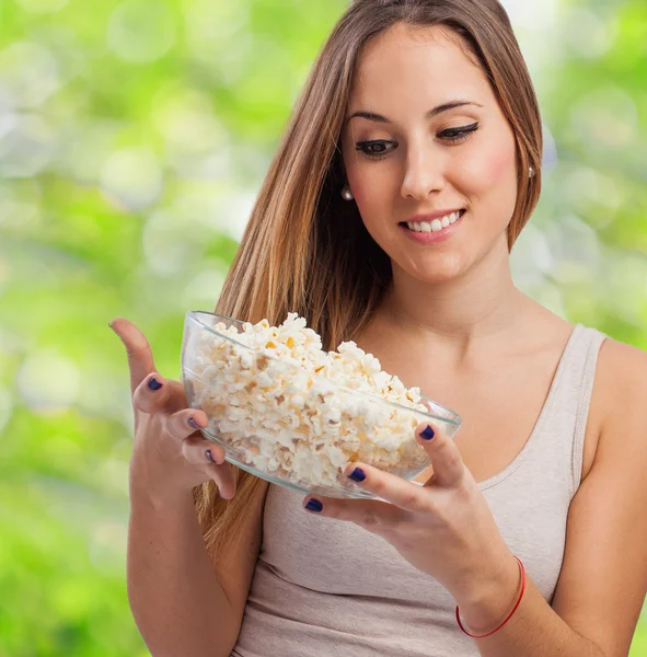 Woman holding popcorn — Stock Photo, Image