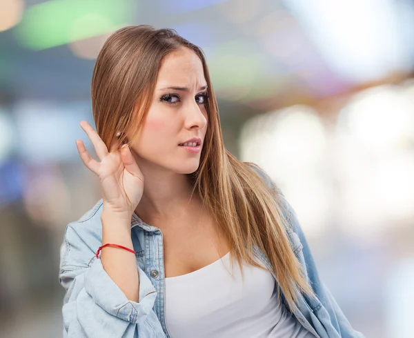 Woman making sign to listen — Stock Photo, Image