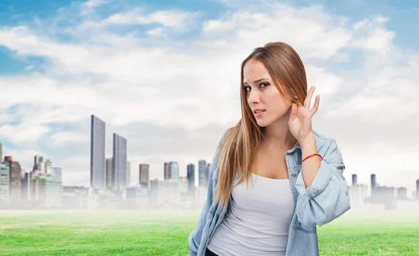 Woman making sign to listen — Stock Photo, Image