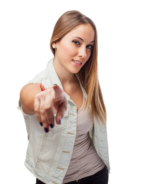 Beautiful young woman making sign to point — Stock Photo, Image