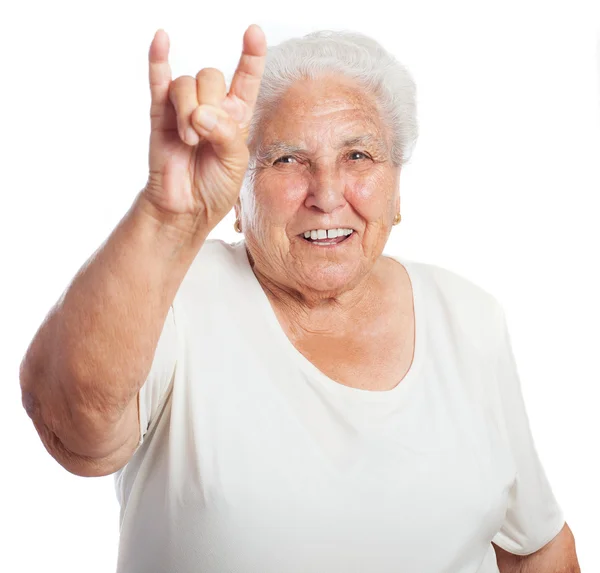 Woman doing a rock gesture — Stock Photo, Image