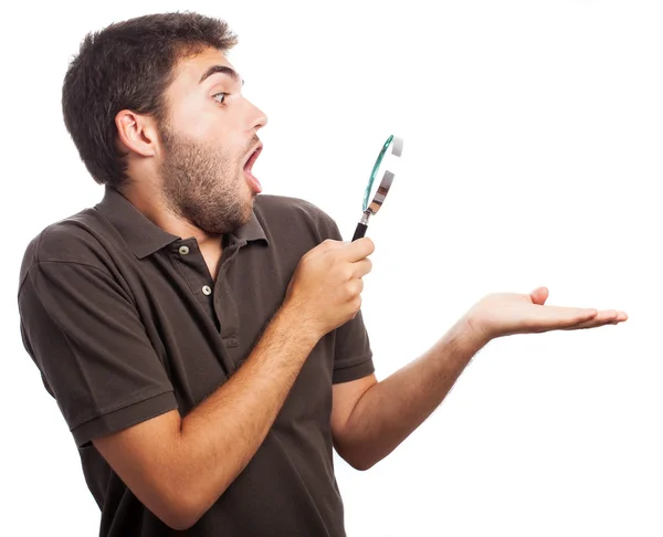 Young man presenting object — Stock Photo, Image