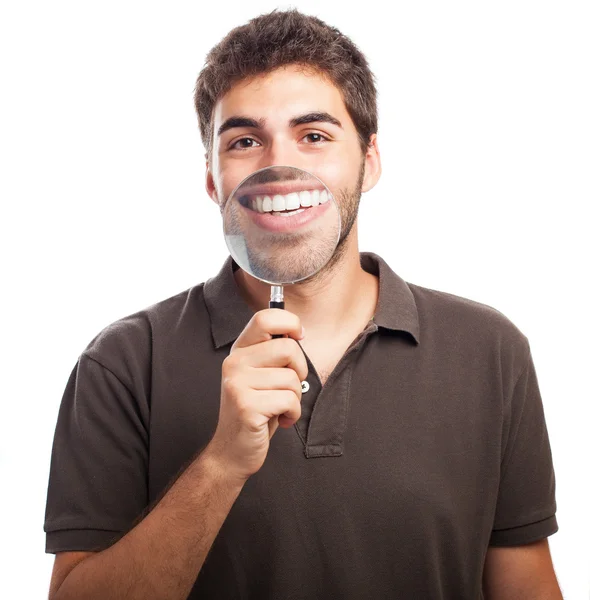 Young man with magnifying glass — Stock Photo, Image