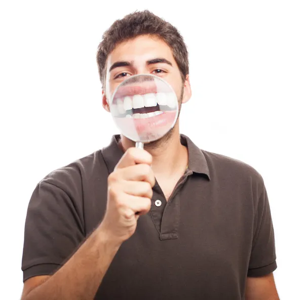 Young man with magnifying glass — Stock Photo, Image