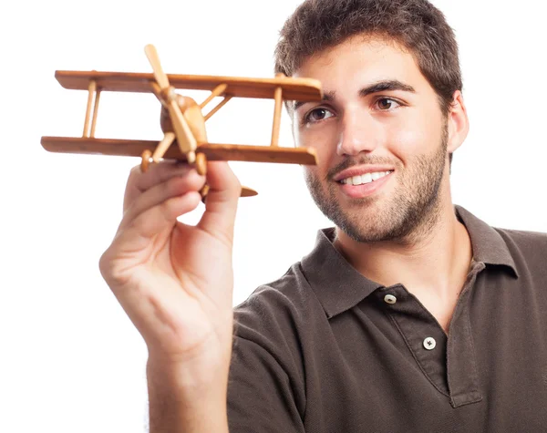 Hombre jugando con avión de madera —  Fotos de Stock