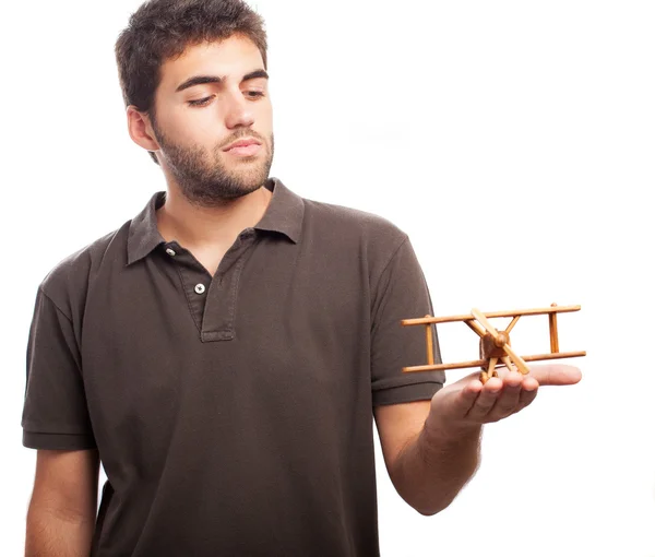 Hombre jugando con avión de madera —  Fotos de Stock