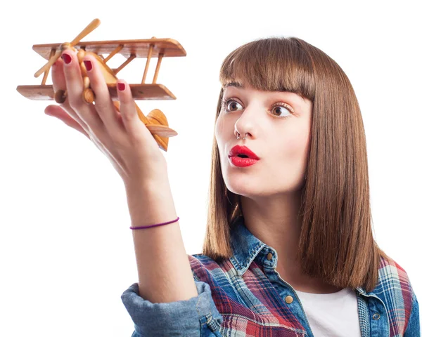 Woman playing with airplane — Stock Photo, Image