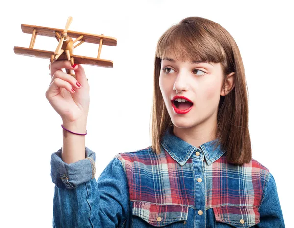 Woman playing with airplane — Stock Photo, Image