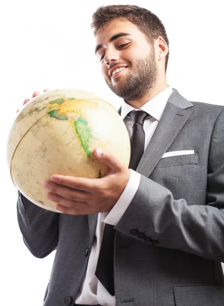 Empresário segurando globo mundial — Fotografia de Stock