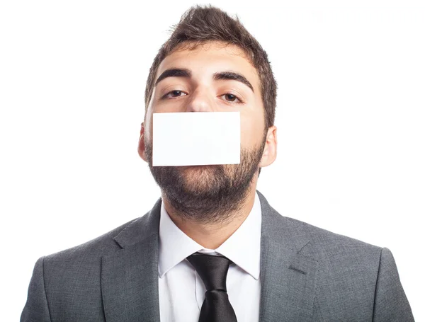Businessman with mouth covered — Stock Photo, Image