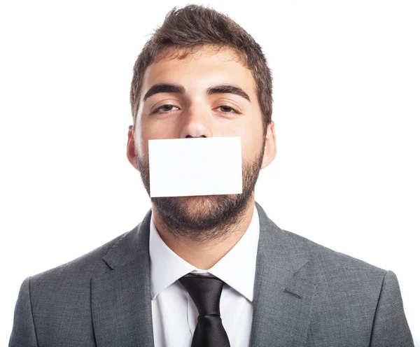 Businessman with mouth covered — Stock Photo, Image