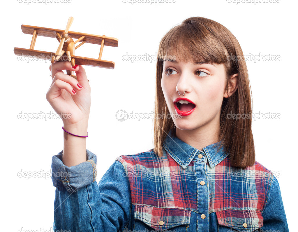 Woman playing with airplane