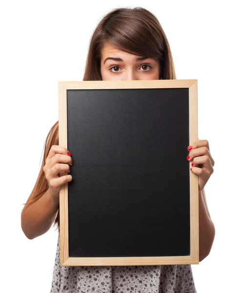 Kvinna anläggning svarta tavlan — Stockfoto
