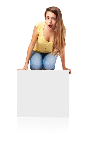 Förvånad tjej på ett papper-affisch — Stockfoto