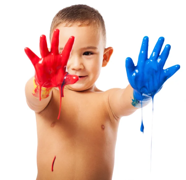 Criança adorável com as mãos pintadas — Fotografia de Stock