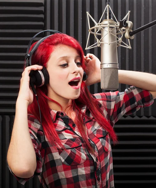 Young woman recording song — Stock Photo, Image