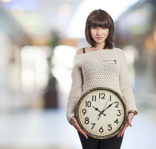 Girl holding clock — Stock Photo, Image