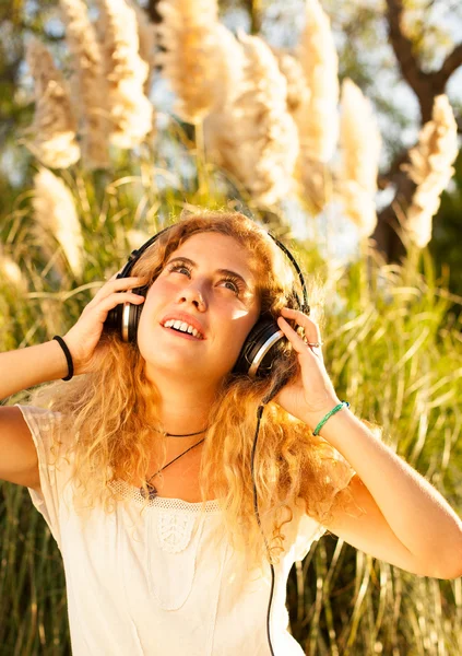 Woman listening music Stock Image