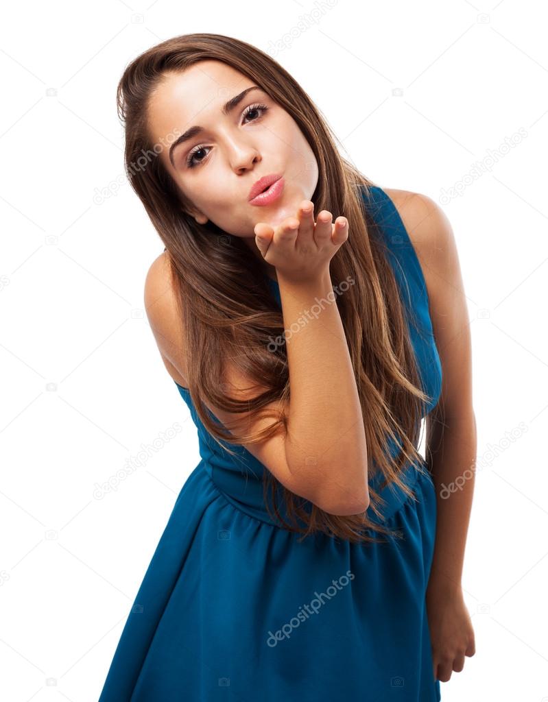 Woman sending kiss on white