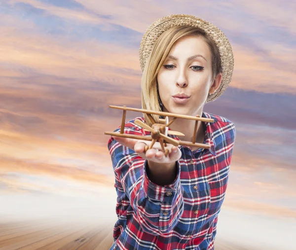 Woman with plane — Stock Photo, Image