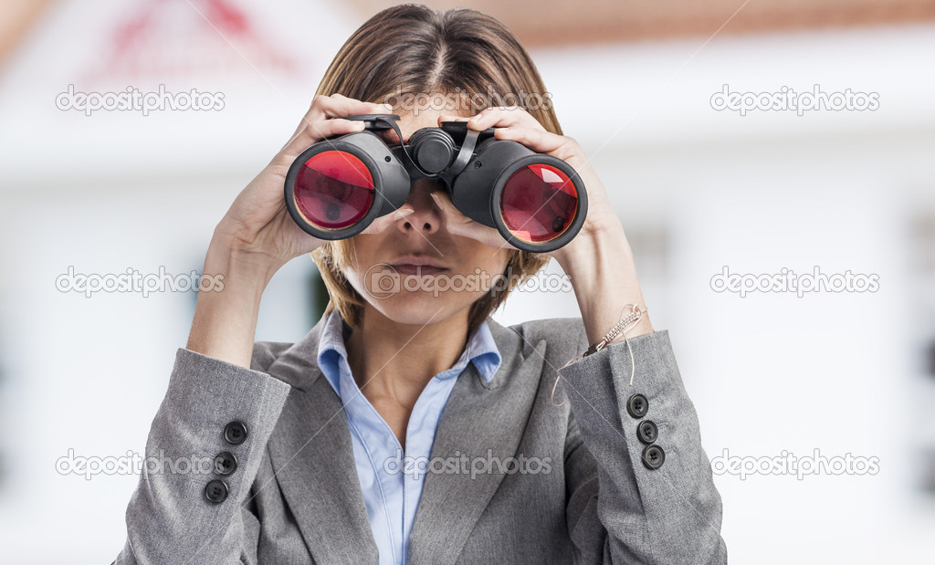 Woman looking through binoculars