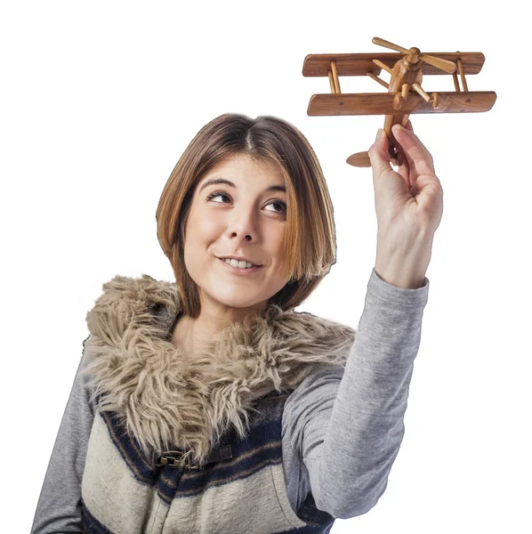 Vrouw spelen met houten vliegtuig — Stockfoto