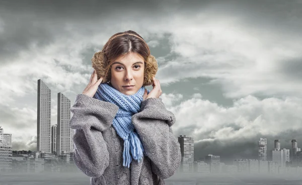 Woman in earmuffs — Stock Photo, Image