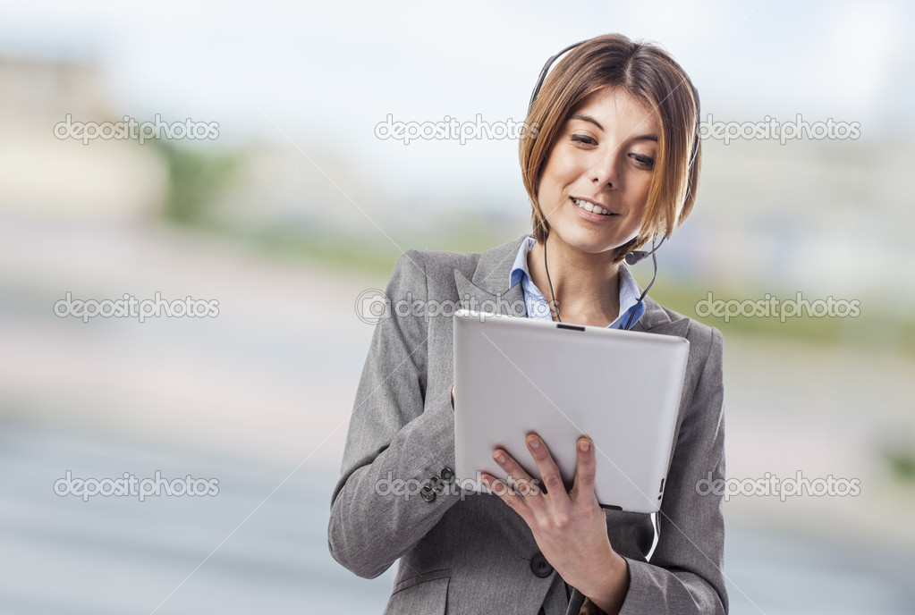 Woman with headphones and tablet