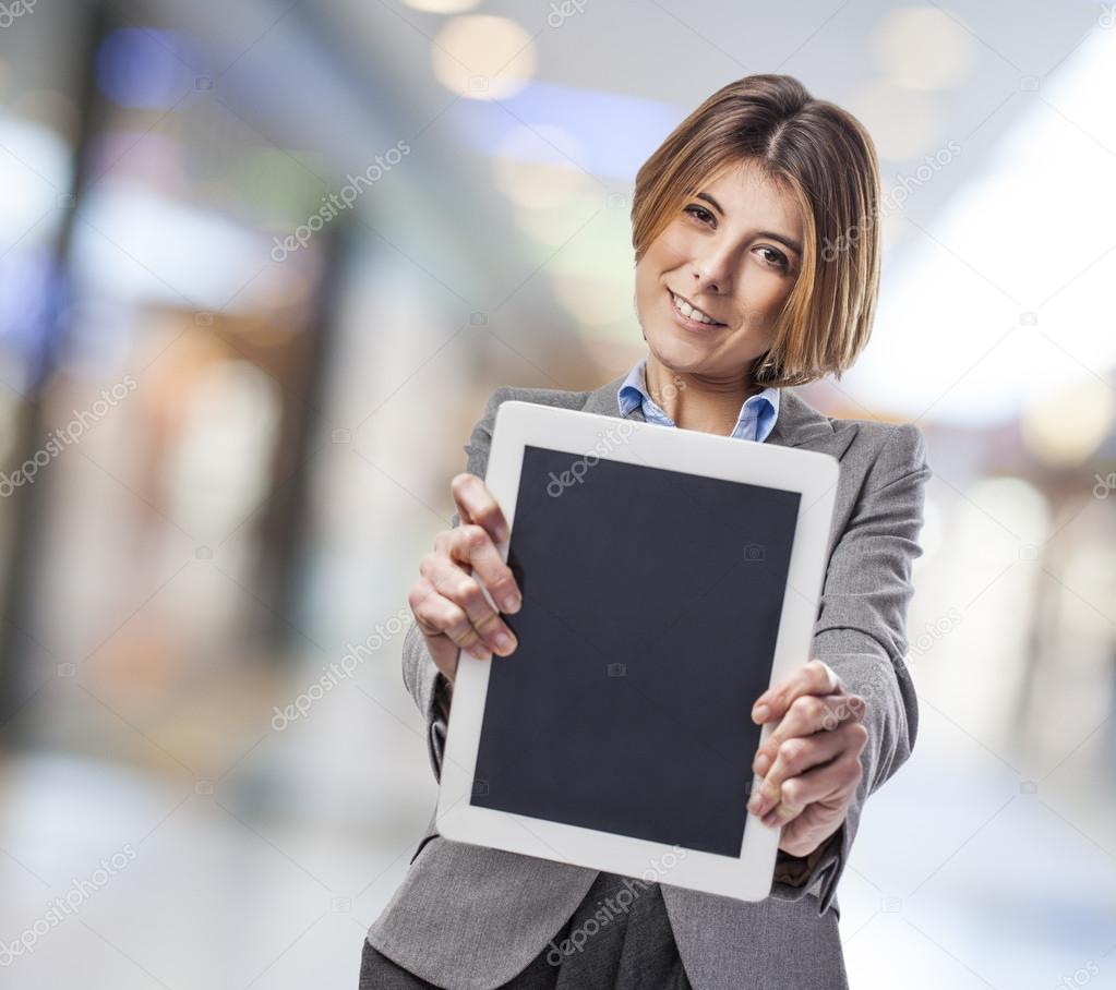 Business woman showing tablet