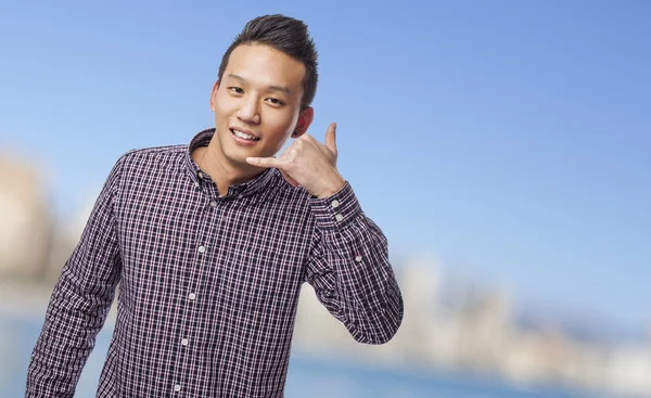 Man doing call gesture — Stock Photo, Image