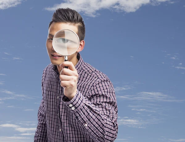 Man med förstoringsglas — Stockfoto