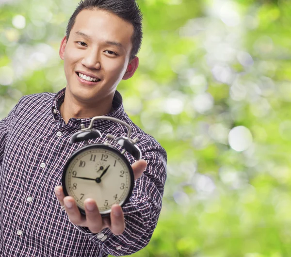 Man holding clock — Stock Photo, Image