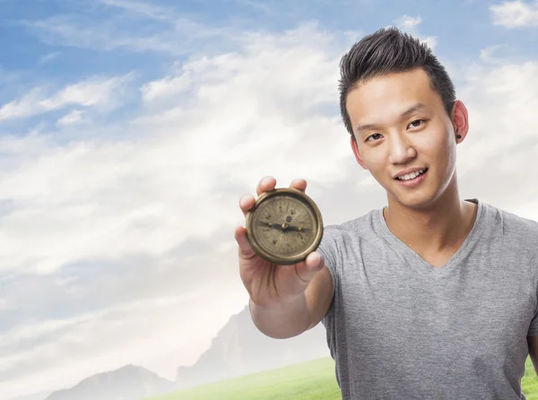 Man holding compass — Stock Photo, Image