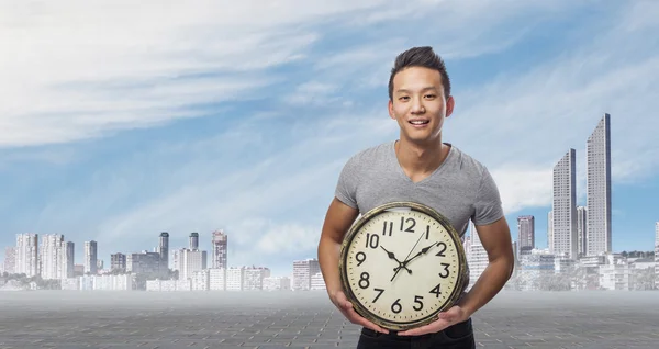 Man holding clock — Stock Photo, Image