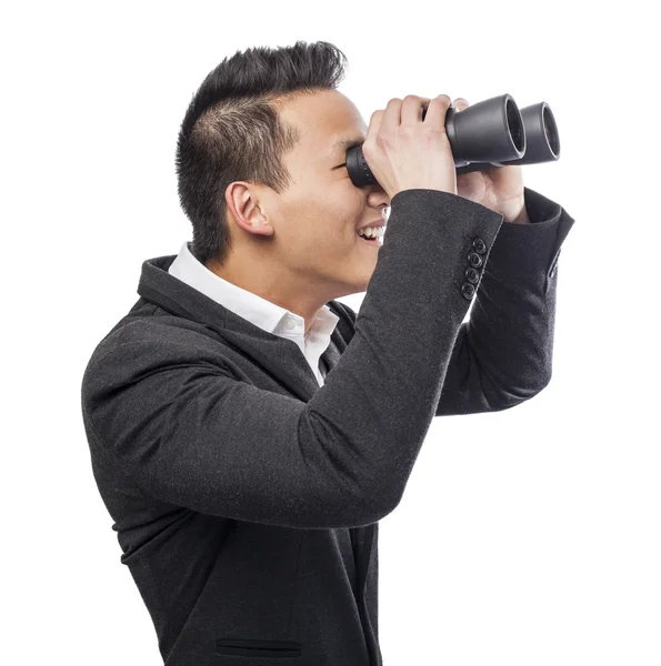 Man looking trough binoculars — Stock Photo, Image