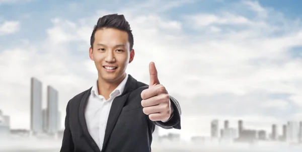 Hombre de negocios con pulgar hacia arriba — Foto de Stock