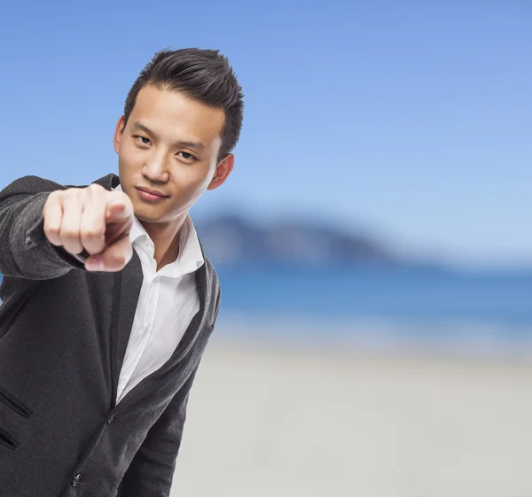 Business man pointing to front — Stock Photo, Image