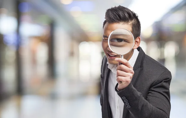 Man with magnifying glass — Stock Photo, Image